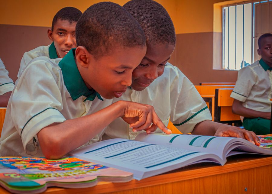 Two pupils reading together